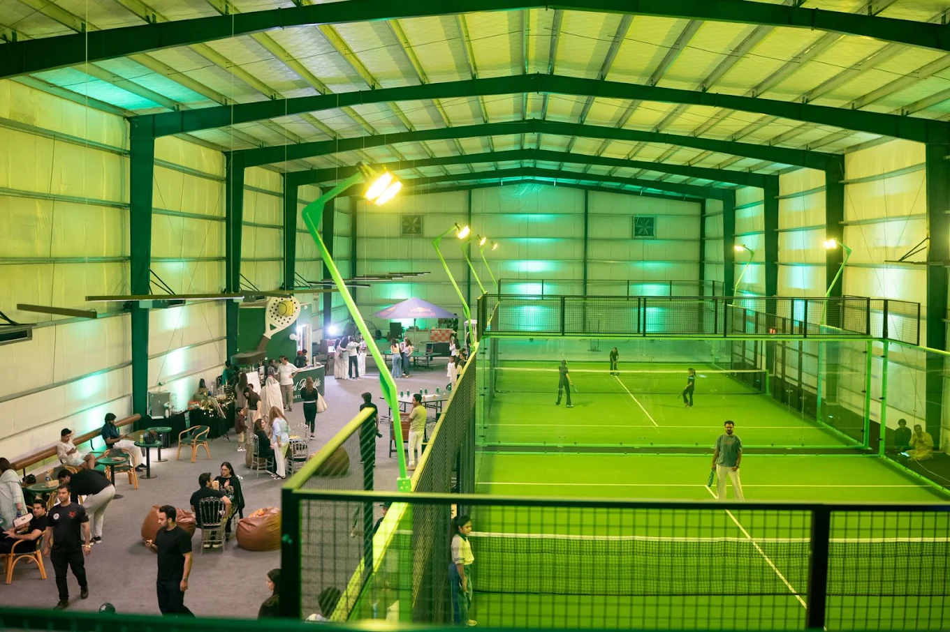 Wide indoor Padel Republic court and cafe view