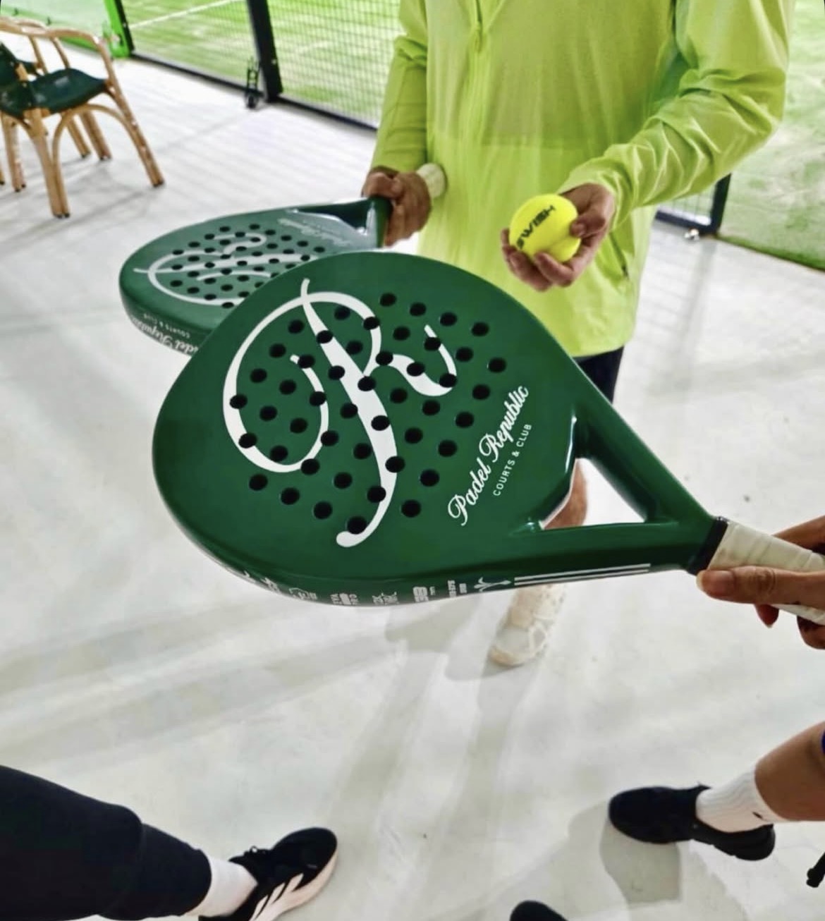 Close-up of branded Padel Republic racket and ball